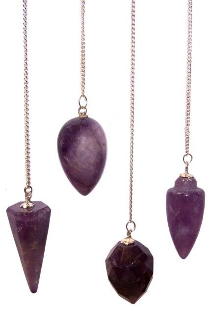 Four amethyst pendulums of various shapes hang from silver chains.