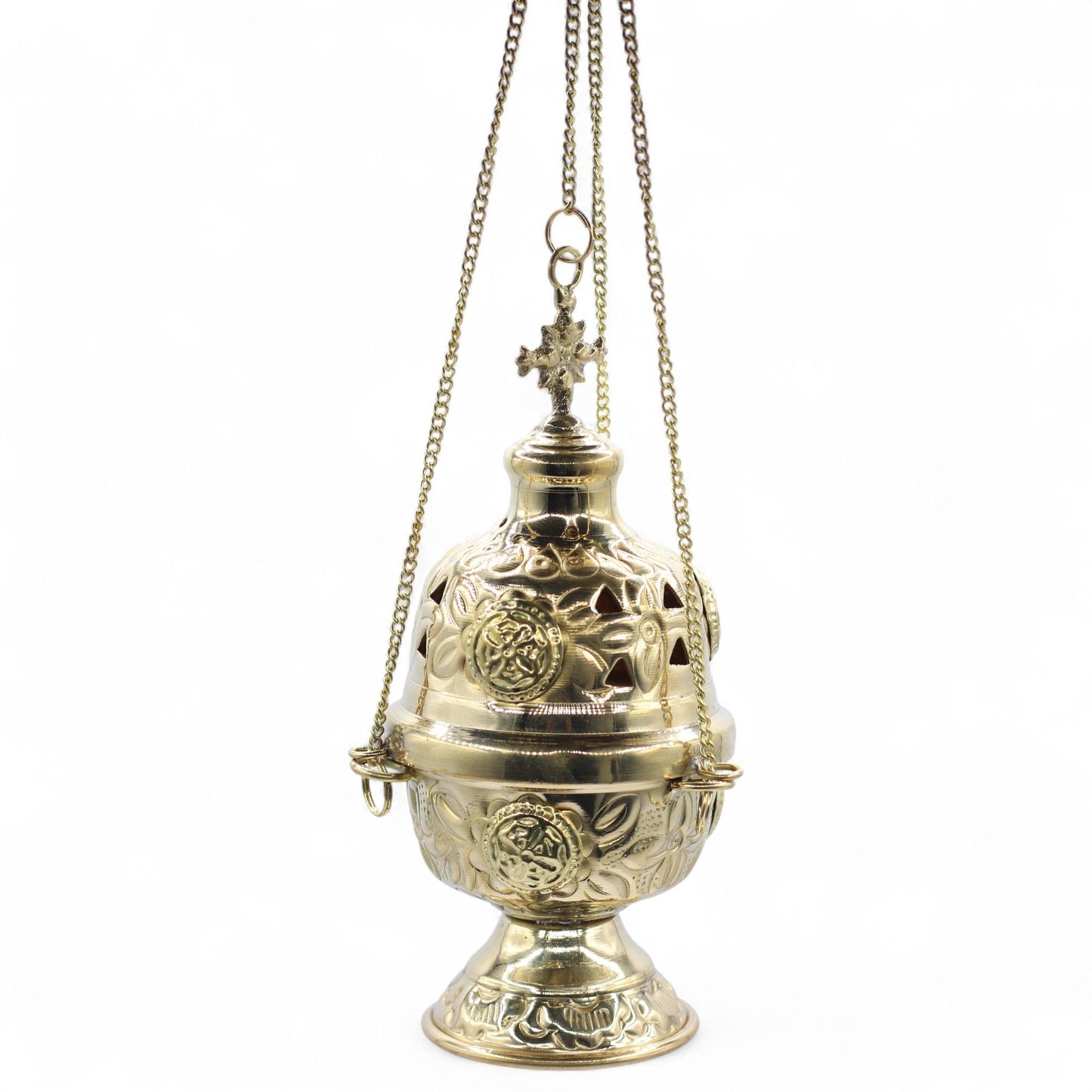 Hanging brass incense burner with intricate floral engravings and a cross finial.