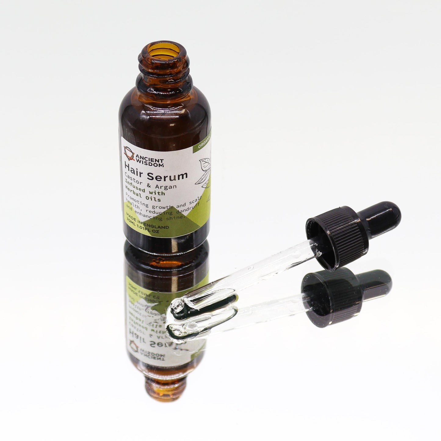 Bio-Kräuter Haarserum mit Rizinus- und Arganöl in Braunglasflasche mit Pipette.