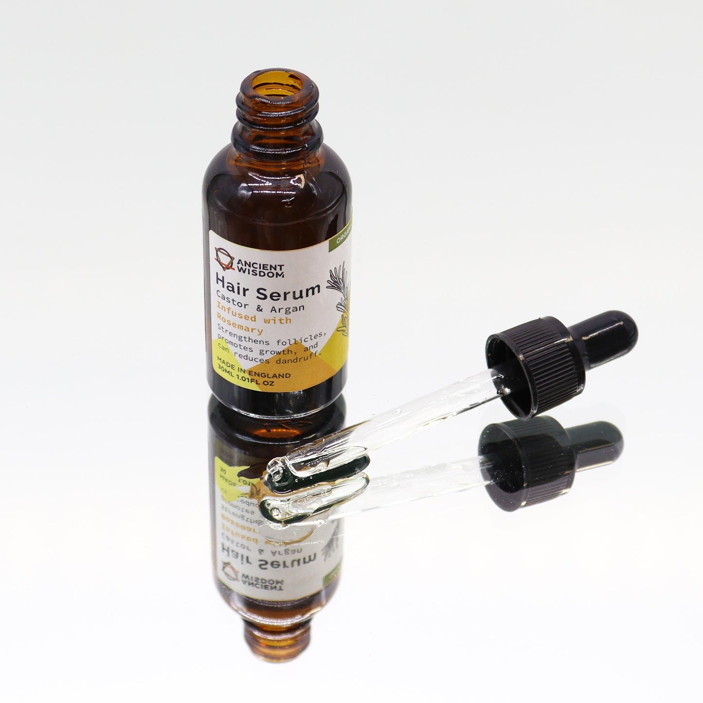 Bio-Rosmarin Haarserum in brauner Glasflasche mit Pipette.
