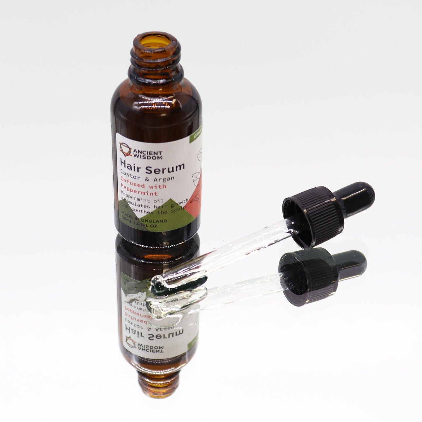 Bio-Pfefferminze Haarserum in Braunglasflasche mit Pipette.