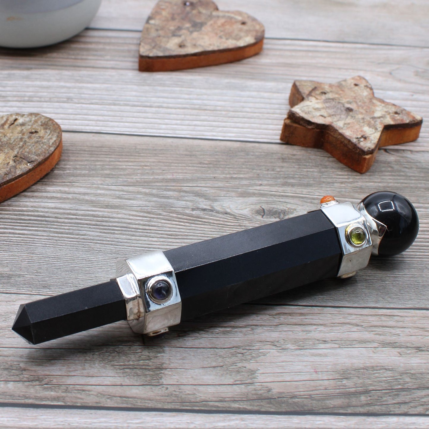 Hexagonal black agate crystal healing wand with decorative gemstones and a black sphere end.