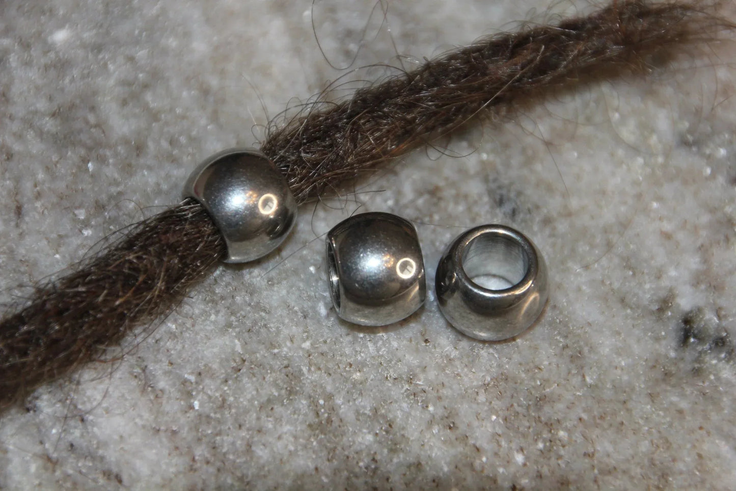 Set of 5 stainless steel dread beads with a 7mm hole diameter.