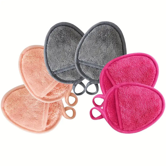 Sechs wiederverwendbare Abschminkpads aus Mikrofaser in den Farben Grau, Lachs und Pink.