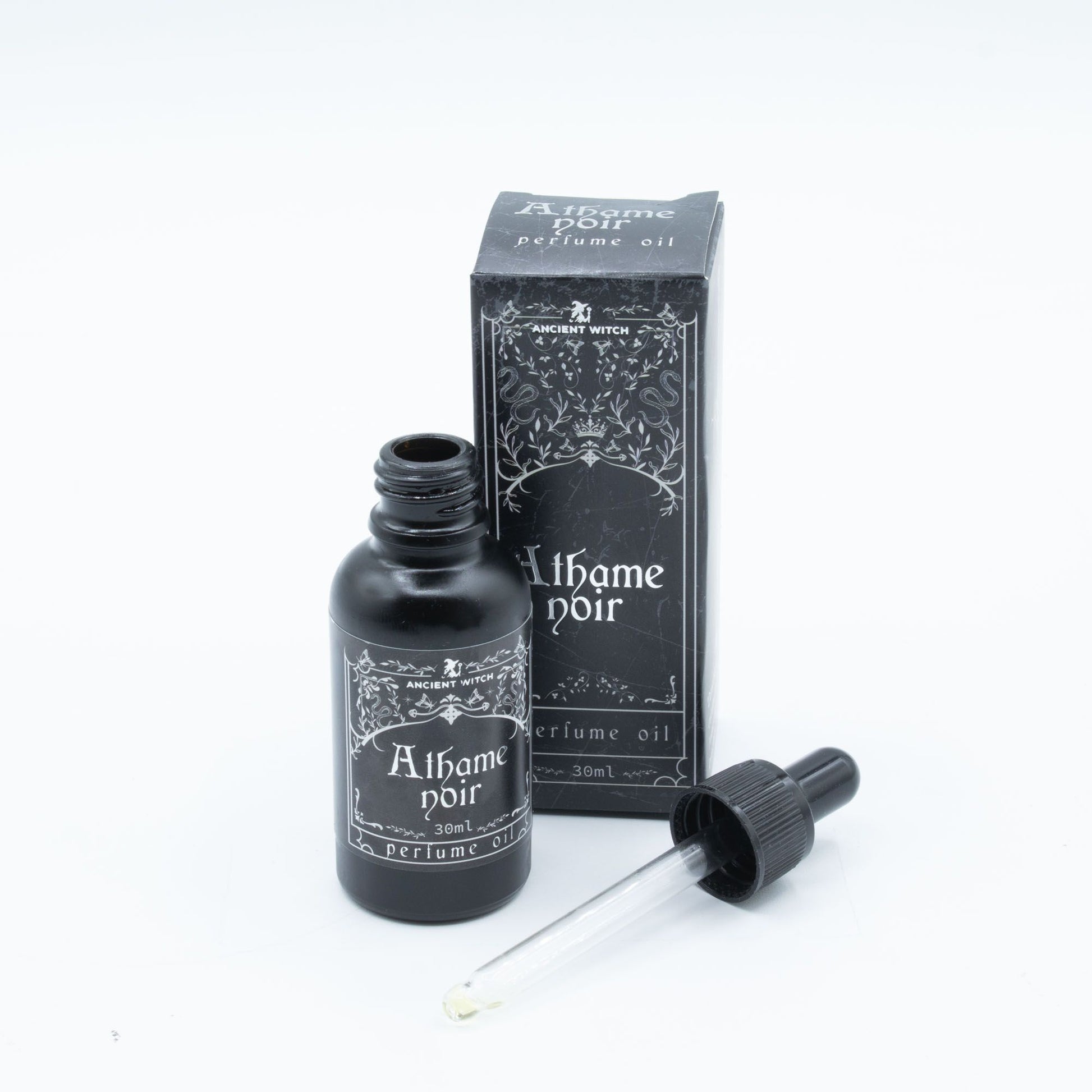 Athame Noir perfume oil bottle and box with a dropper.