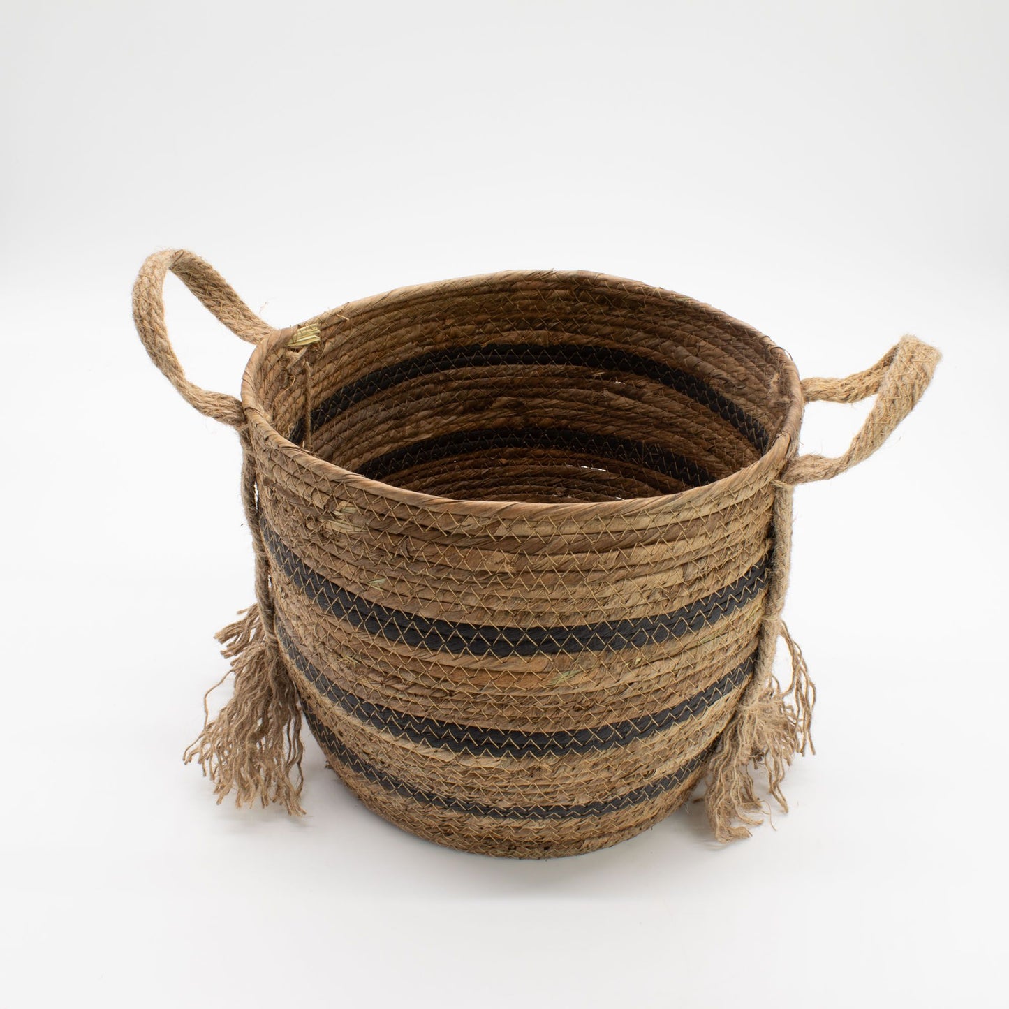Woven seagrass basket with black stripes and rope handles.