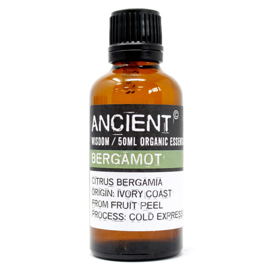 Amber glass bottle of Bergamot essential oil with a black cap.
