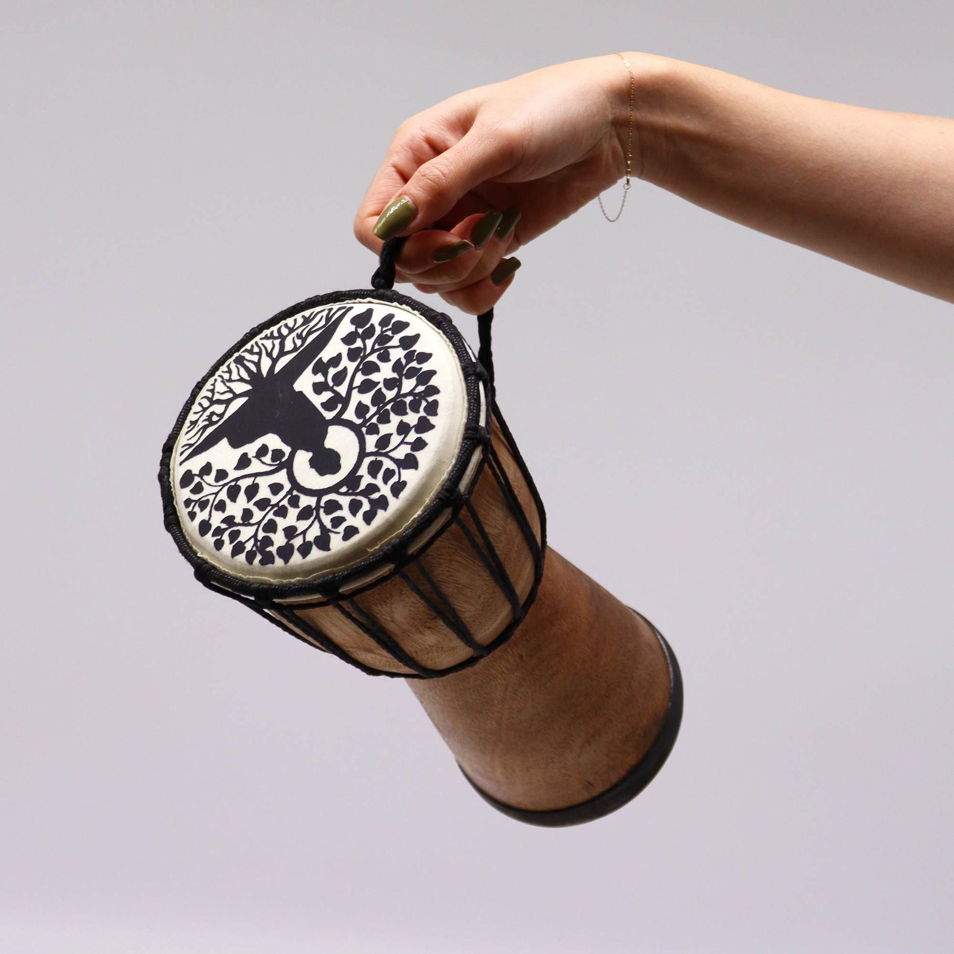 Handmade wide top djembe drum with a bird and tree design.