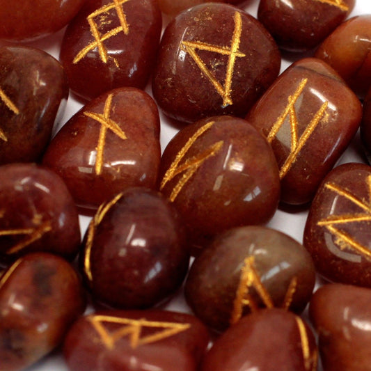 Red aventurine rune stones with gold symbols.