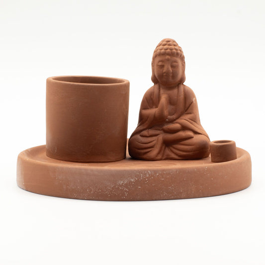 Ein Keramik-Räucherhalter mit Buddha-Figur für verschiedene Räucherwerke.