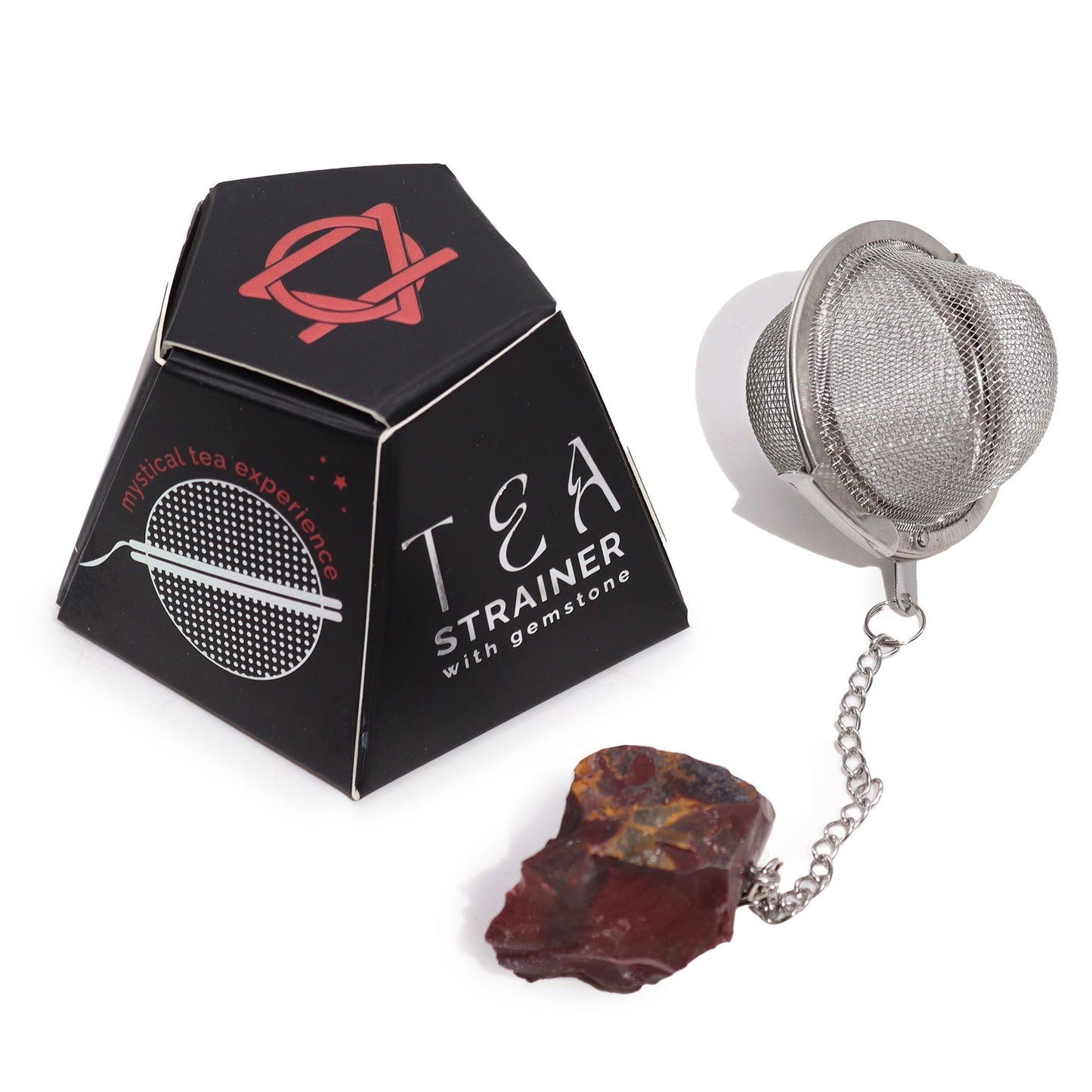Teesieb aus Edelstahl mit einem rohen Mookait-Kristall und einer schwarzen Box.