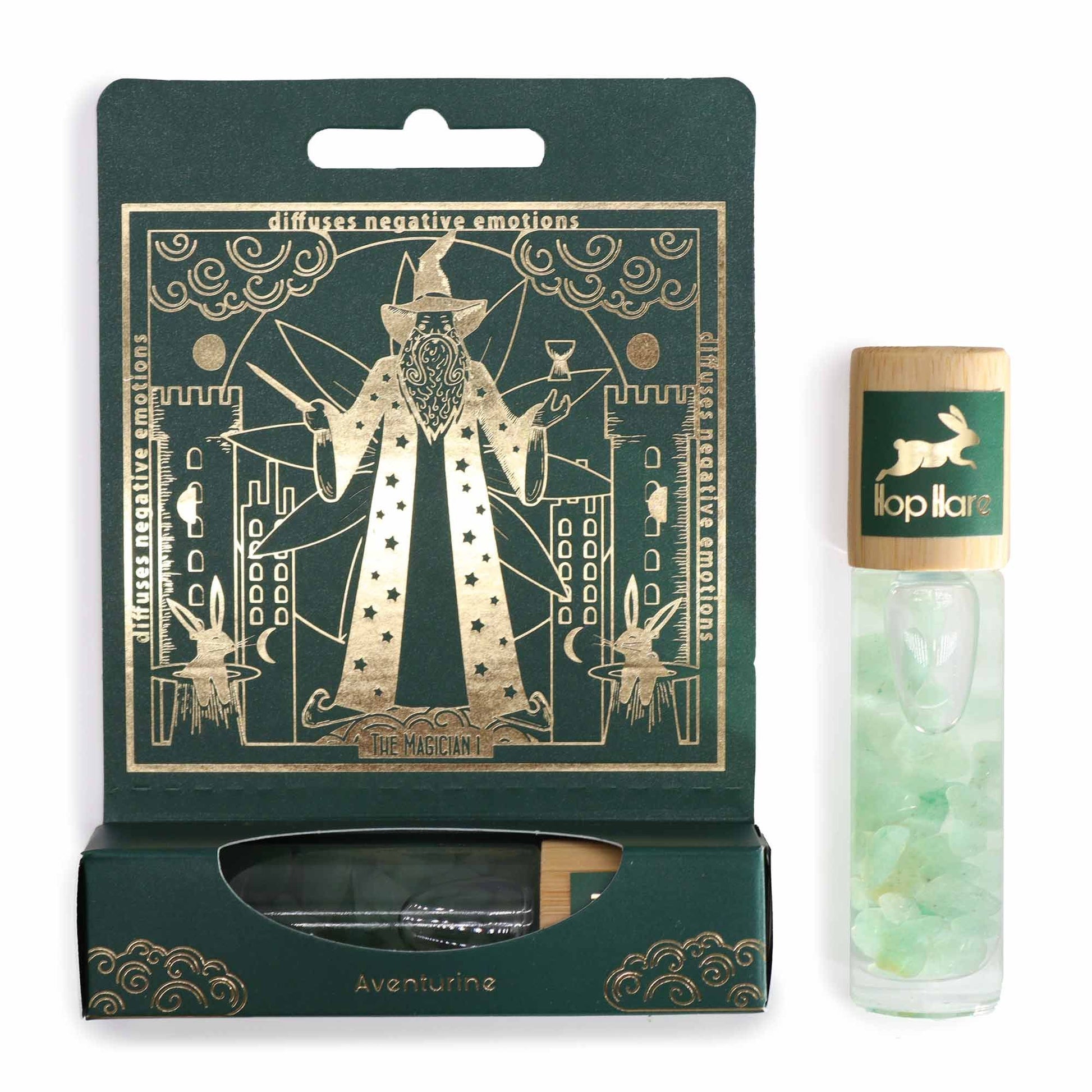 Ein Roll-On mit grünem Aventurin und Minzduft auf einer Tarot-inspirierten Verpackung.