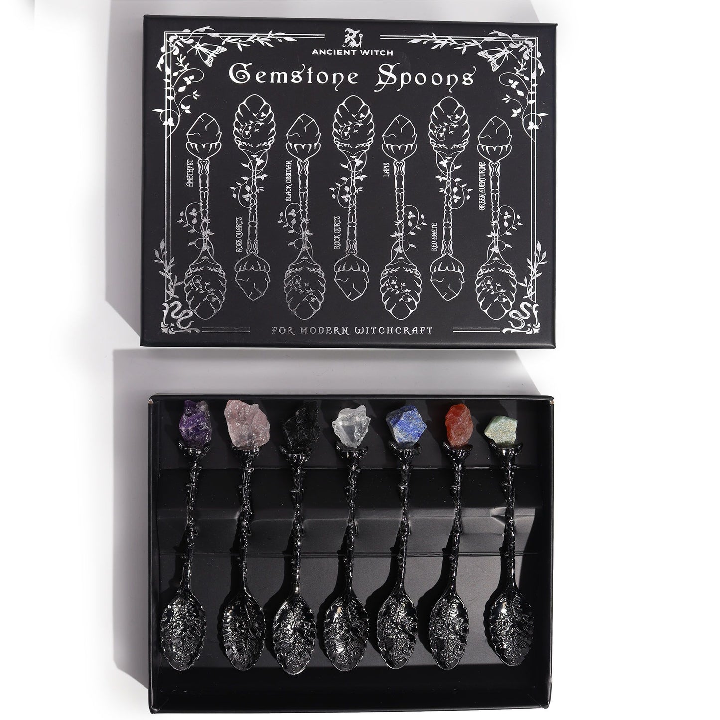 Set of 7 dark silver spoons with raw gemstone crystals on the handles.