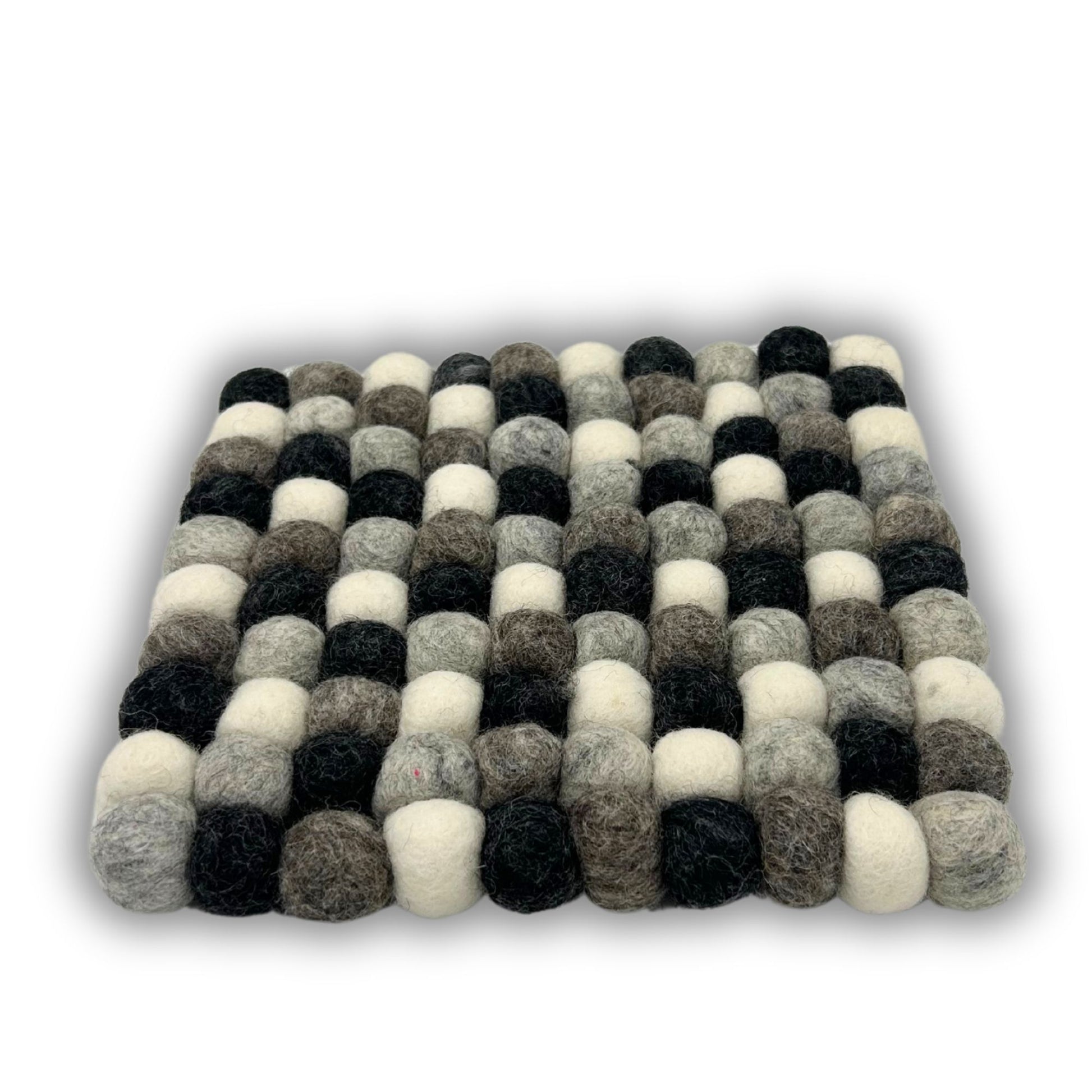 Square placemat made of grey, black, and white felt balls.