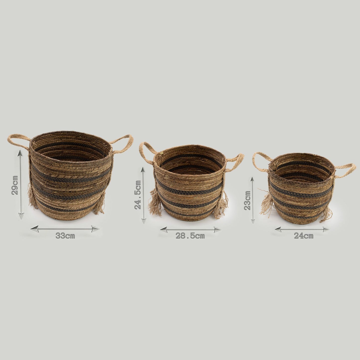 Set of 3 natural brown banana leaf and seagrass baskets with striped detailing and handles.