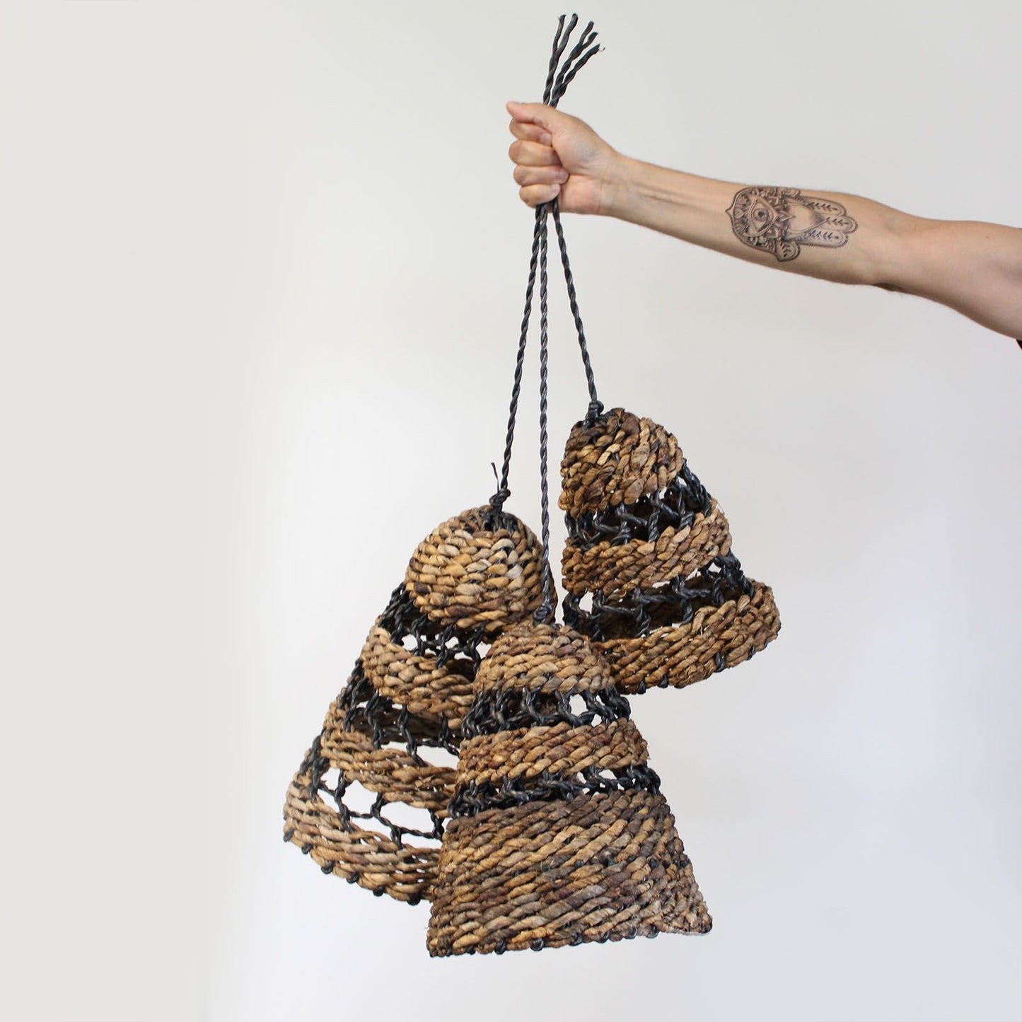 Set of 3 natural banana leaf lamp shades with woven texture.