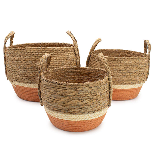Set of 3 natural and orange straw and seagrass baskets with handles.