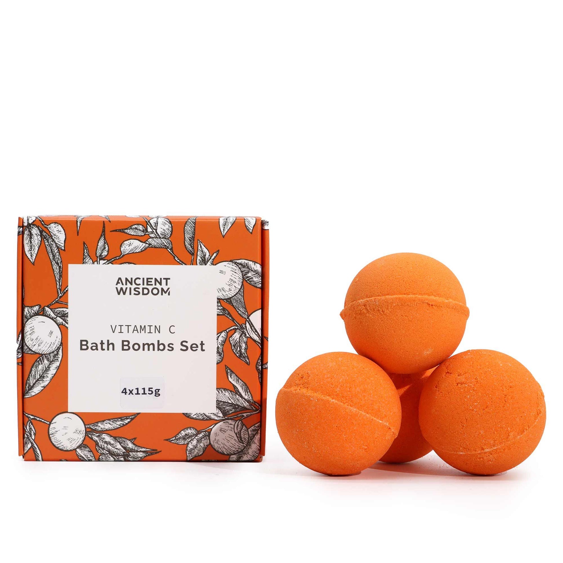 Ein Set aus vier orangefarbenen Vitamin-C-Badebomben neben einer orangefarbenen Schachtel mit Zitrusmuster.