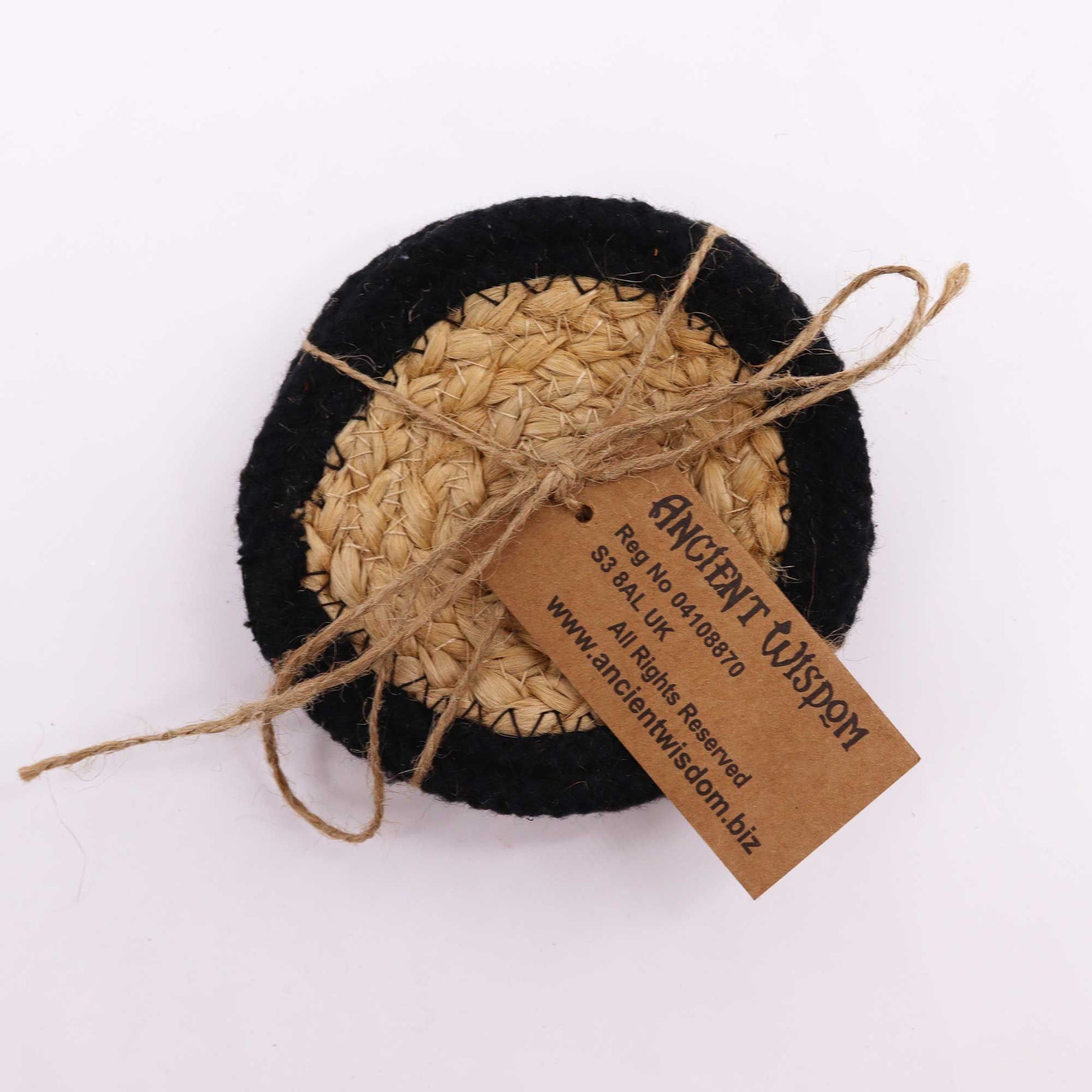 Set of 4 round jute and cotton coasters with black border.