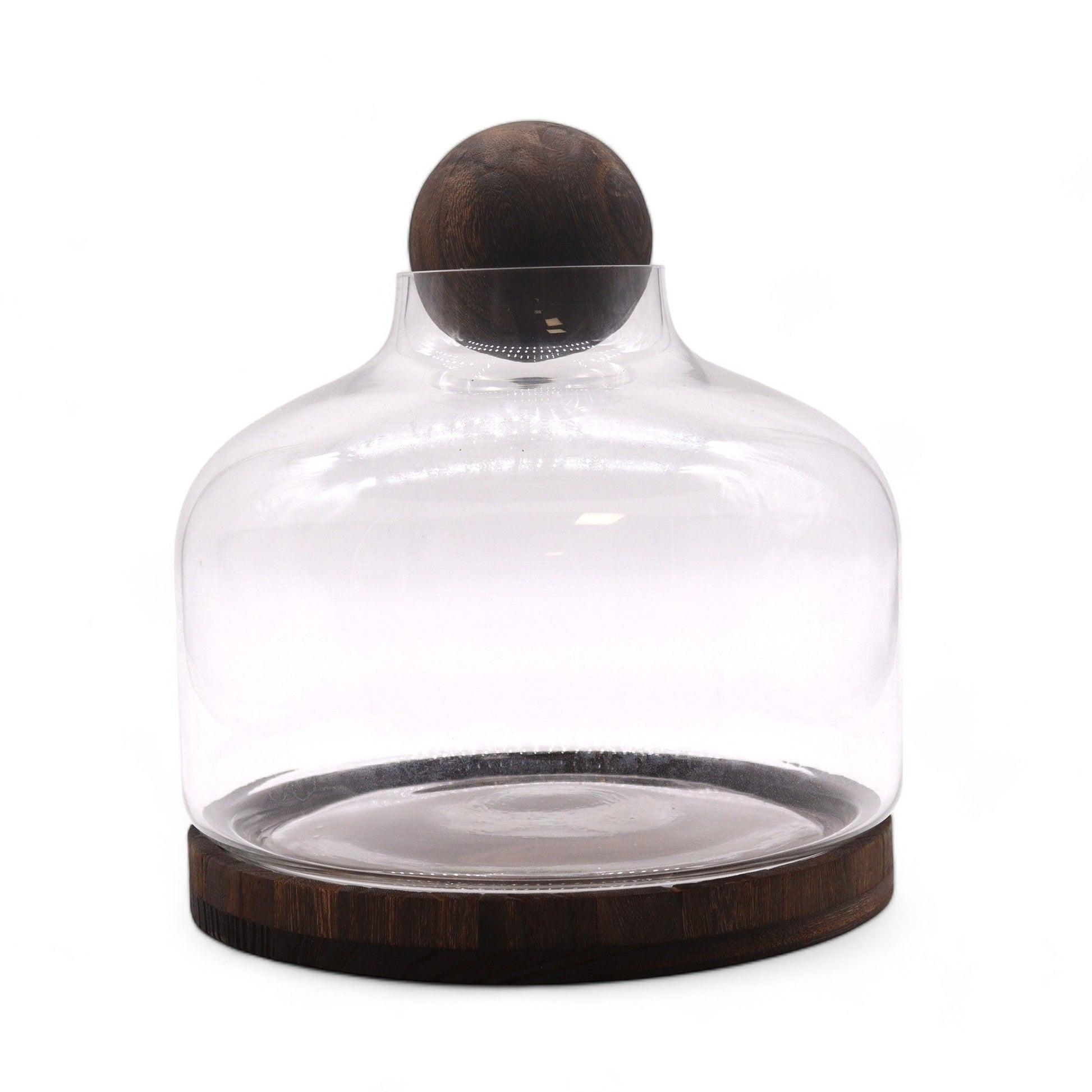 Extra large glass terrarium with a dark wood base and a wooden ball top.