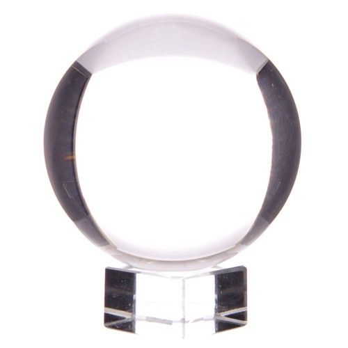 Clear crystal ball on a clear square stand.