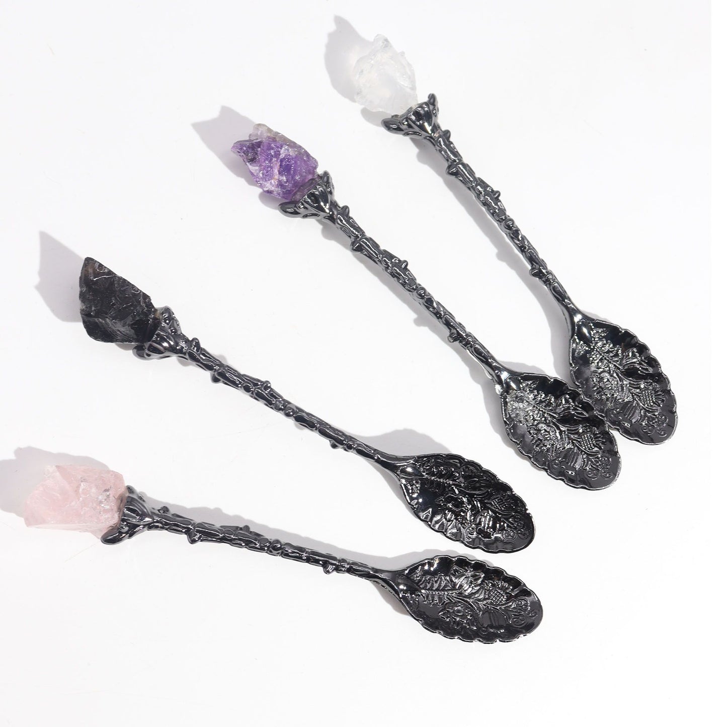 Set of 7 dark silver spoons with gemstone crystal handles.