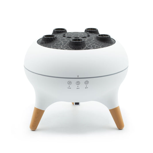 White aroma diffuser with a textured top, four mist outlets, and wooden legs.