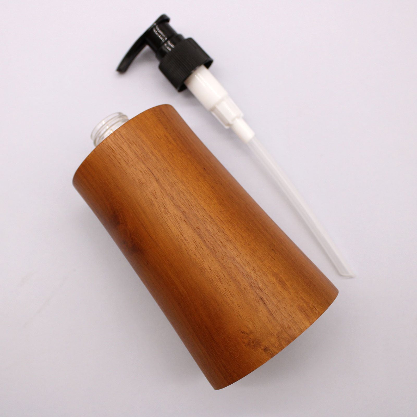 Natural teakwood soap dispenser with a black pump dispenser.