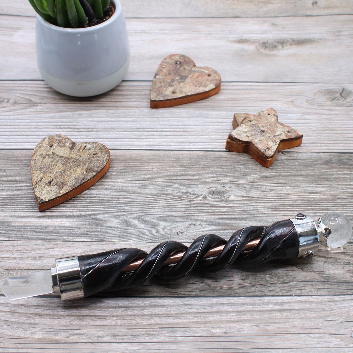 Spiral carved healing wand with copper pipe and rock quartz accents.