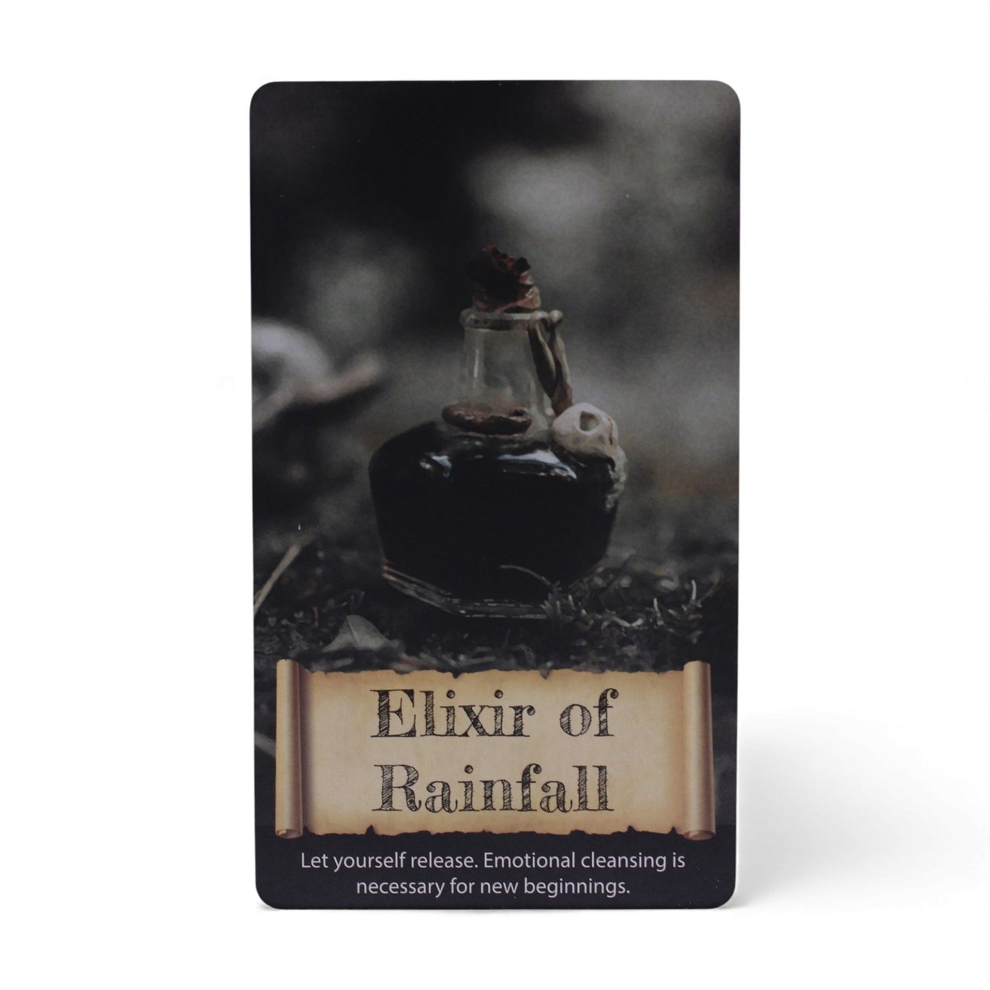 Ein Orakelkartendeck mit 40 Karten, das ein Elixier der Regenfall-Karte zeigt.