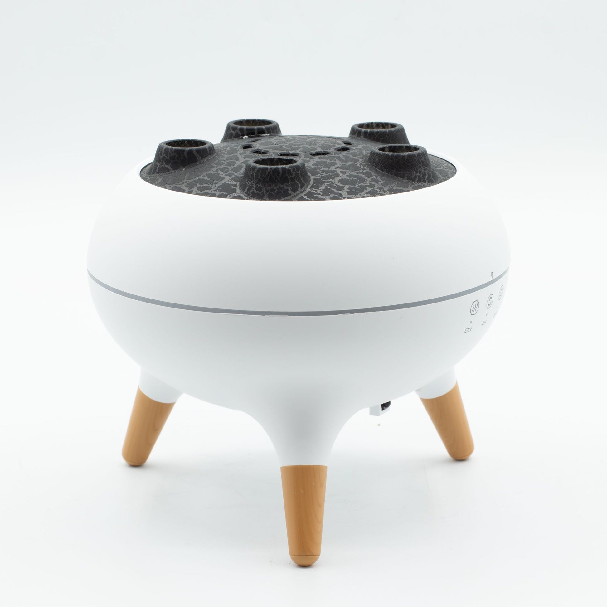 White jellyfish puff effect aroma diffuser with wooden legs and LED lights.