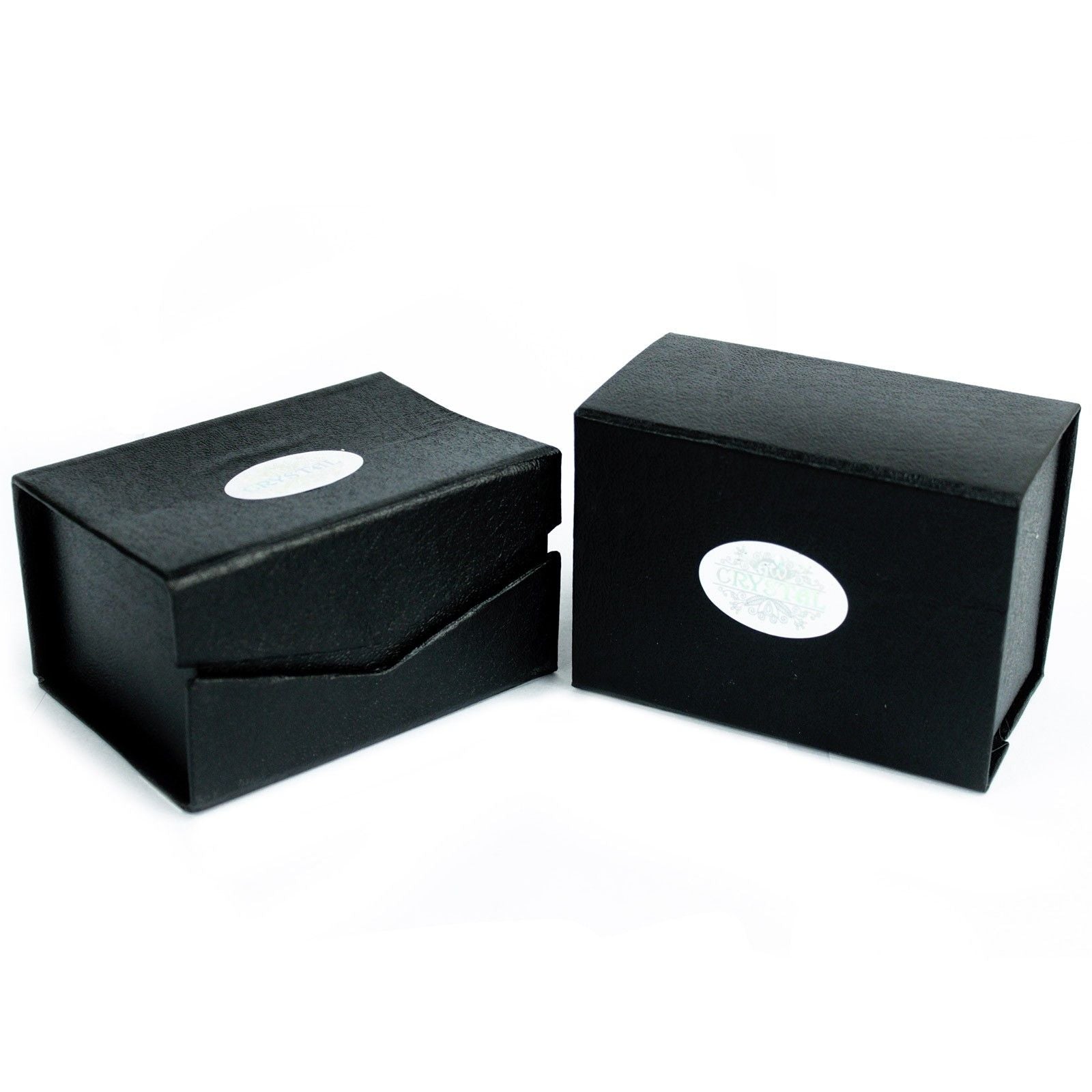 Two black gift boxes with oval silver labels.