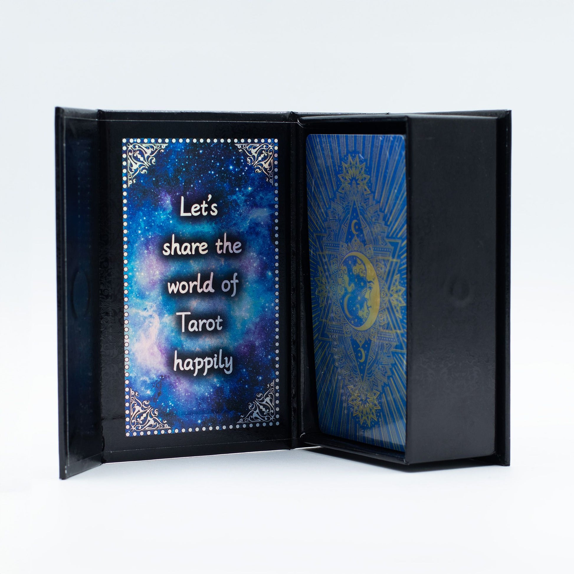 A blue foil tarot card set with moon face design and a booklet.