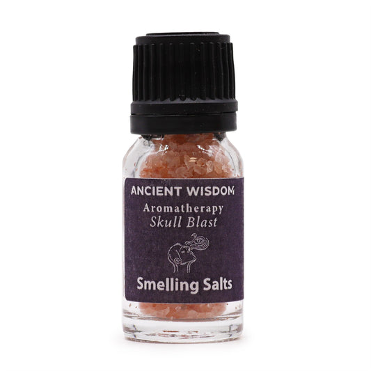 A small glass bottle of pink smelling salts with a black cap and a dark purple label.