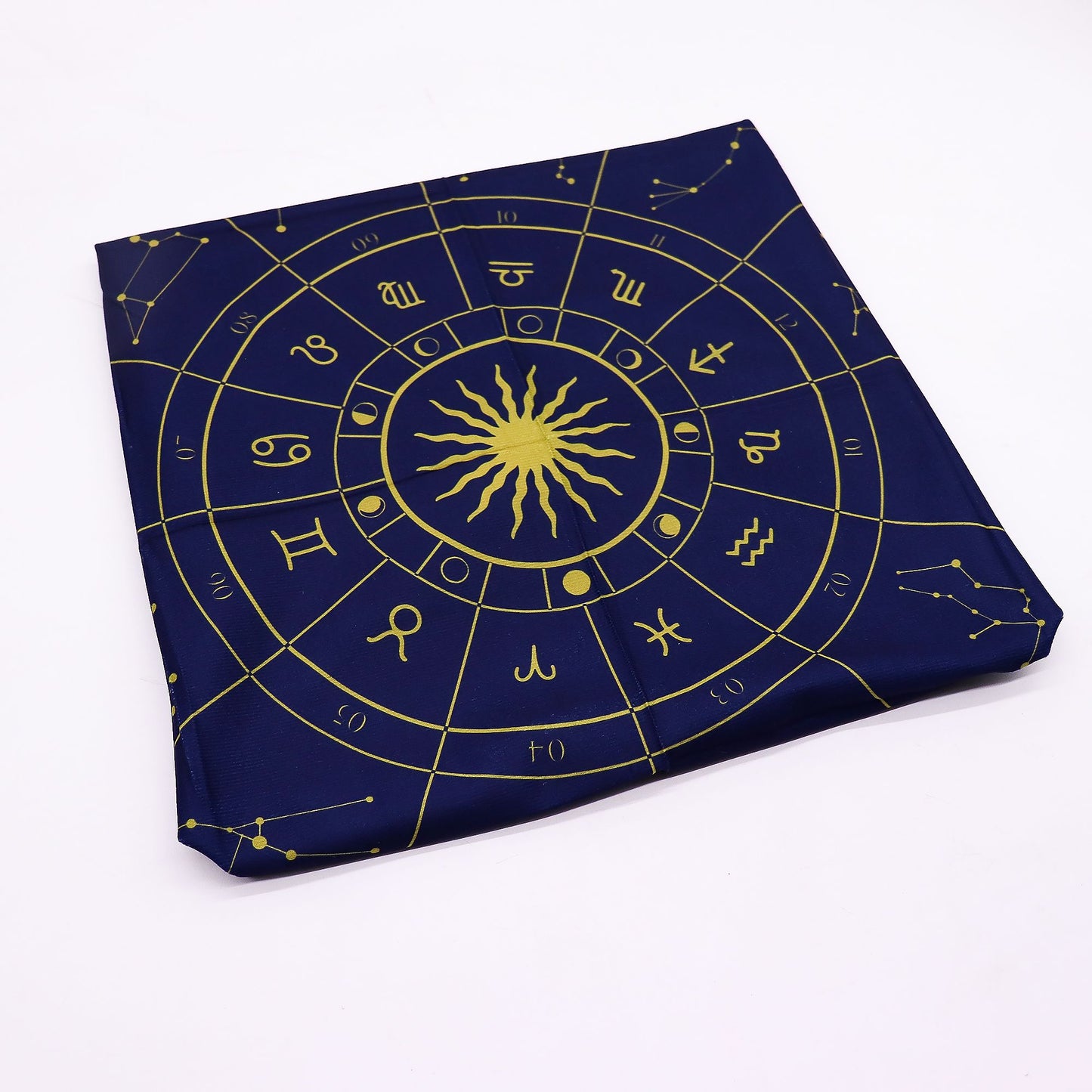 A dark blue cloth with a gold zodiac wheel design.
