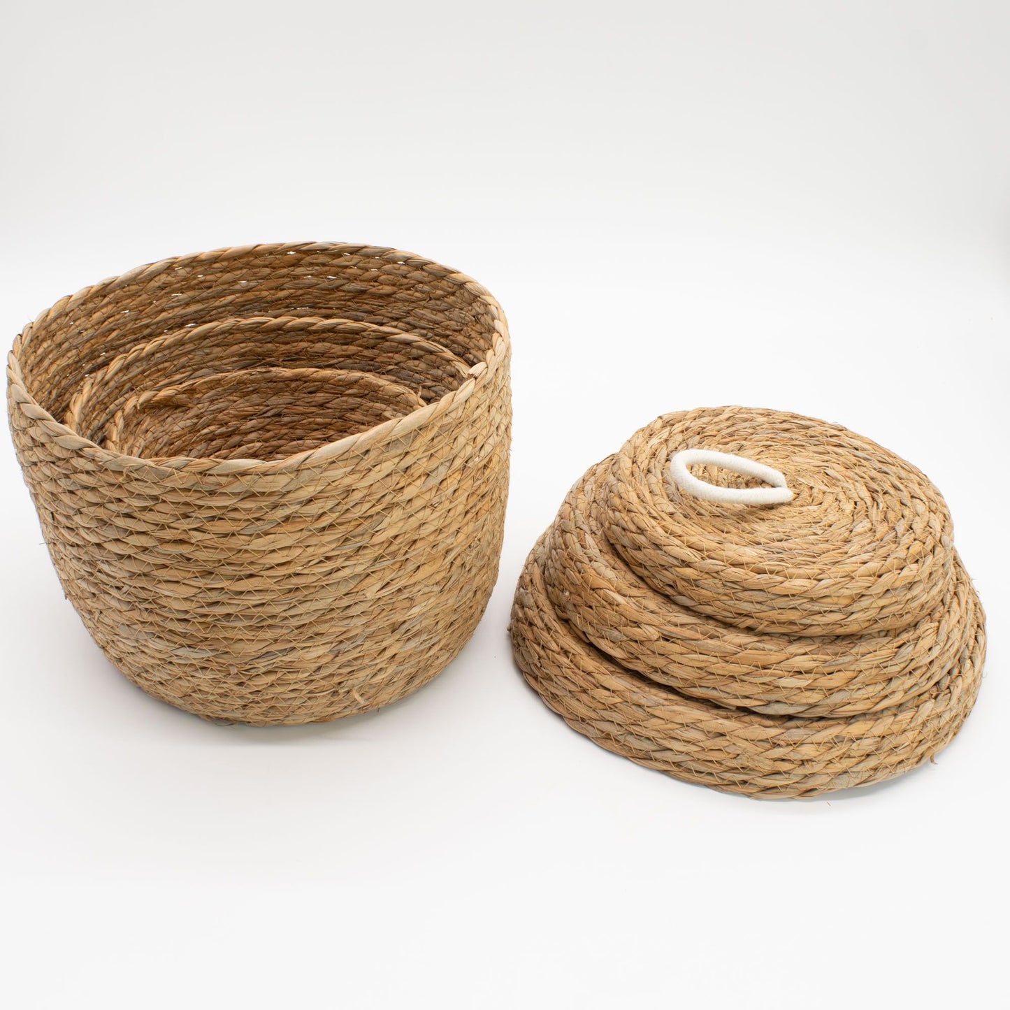 Set of 3 natural seagrass round baskets with cotton detailing and lids.