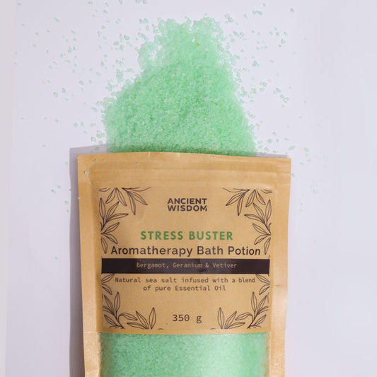 Kraft bag of green aromatherapy bath potion labeled "Stress Buster".