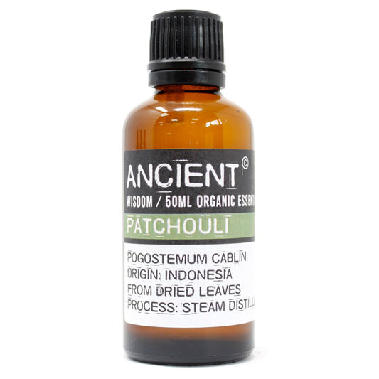 Amber glass bottle of Ancient Wisdom Patchouli essential oil.