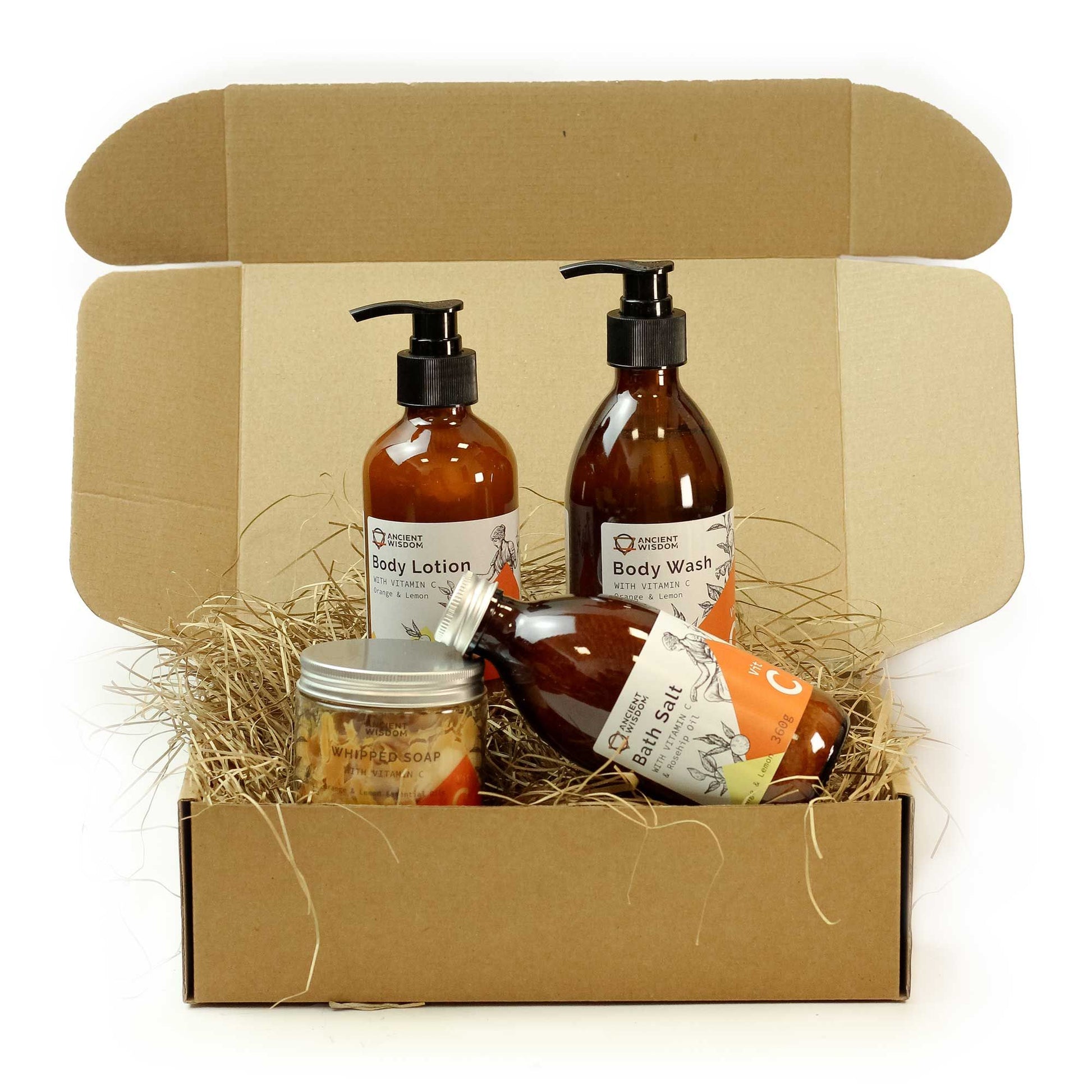 A gift box containing body lotion, body wash, bath salt, and whipped soap.