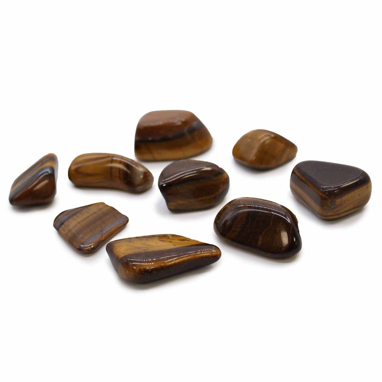 A collection of polished tiger eye stones with golden brown stripes.