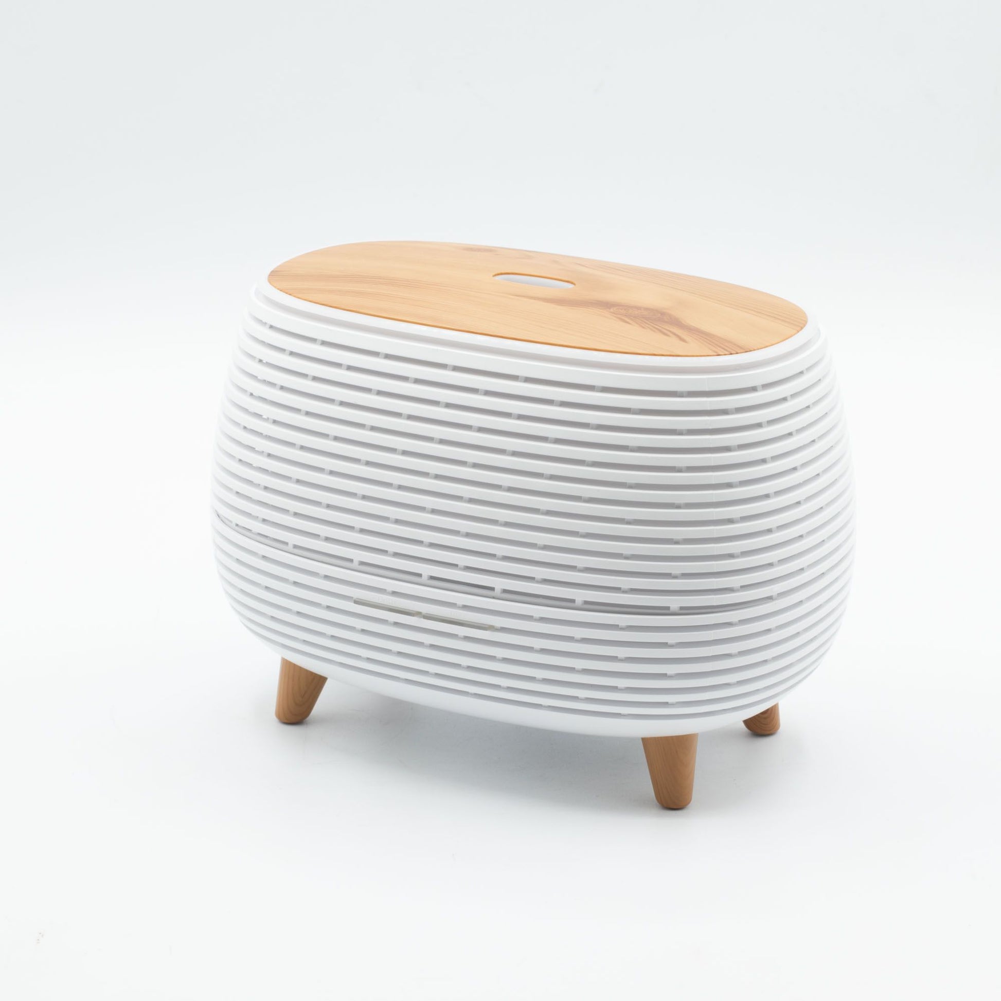 Futuristic ribbed aroma diffuser with wood-effect top and color-changing light.