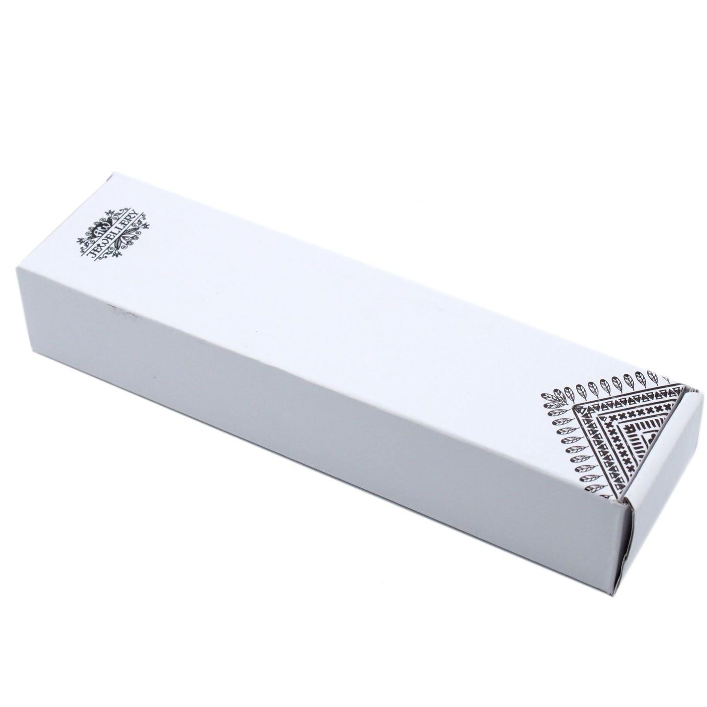 A white rectangular box with black tribal-like designs on the corners.