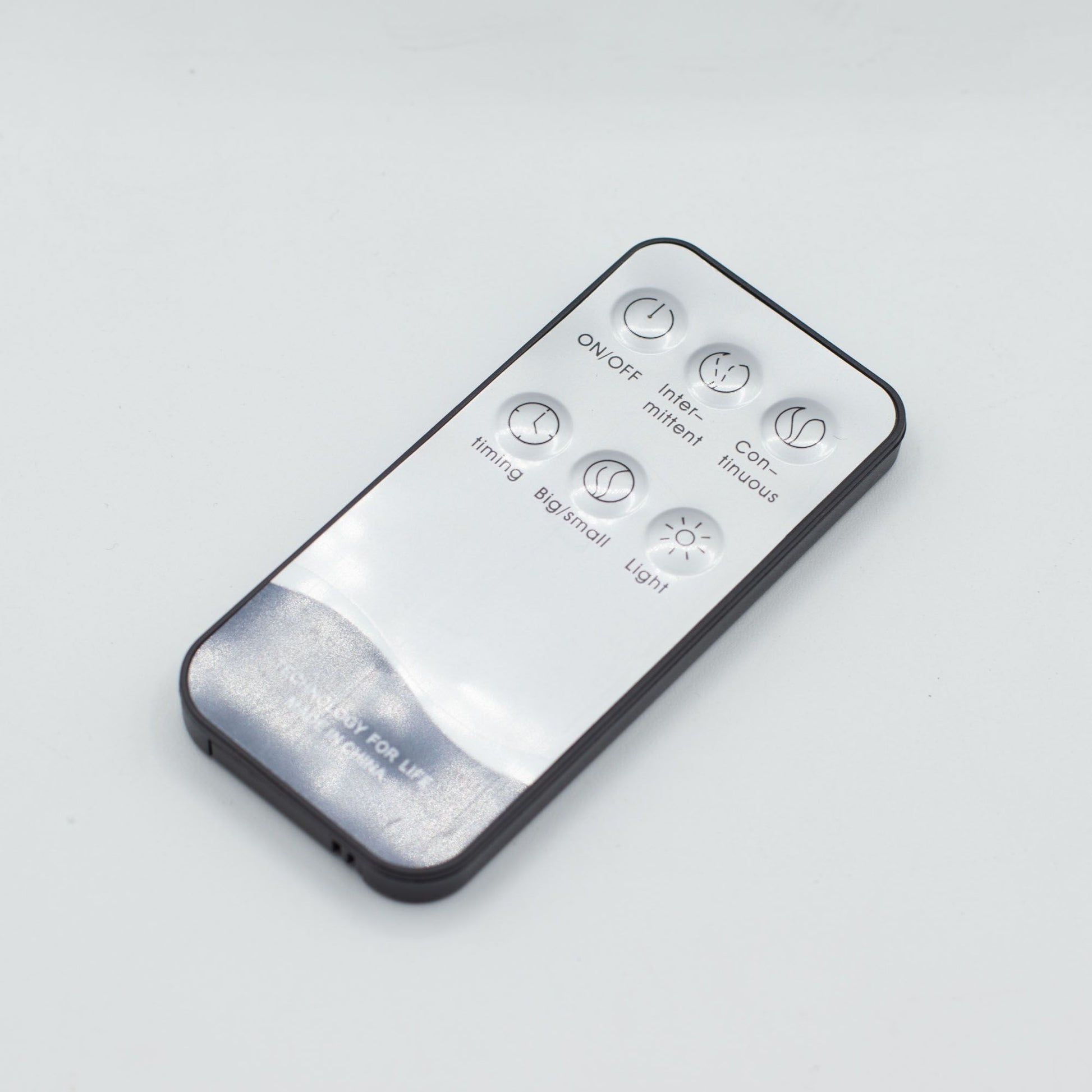 White remote control with buttons for ON/OFF, timing, and light.