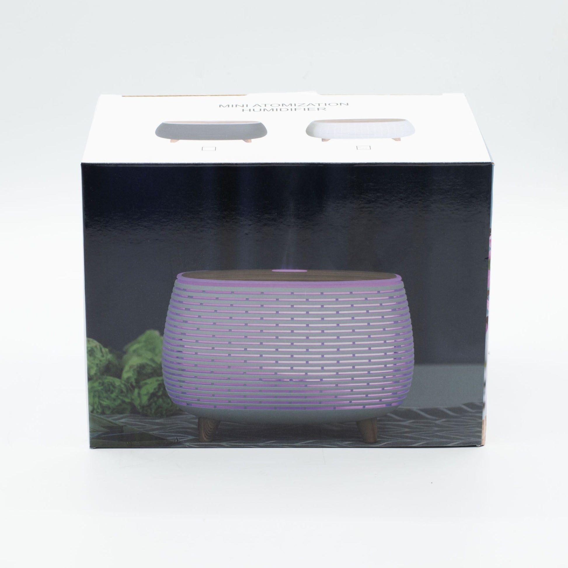 Aromatherapy diffuser with ribbed design, wood-effect top, and color-changing light.