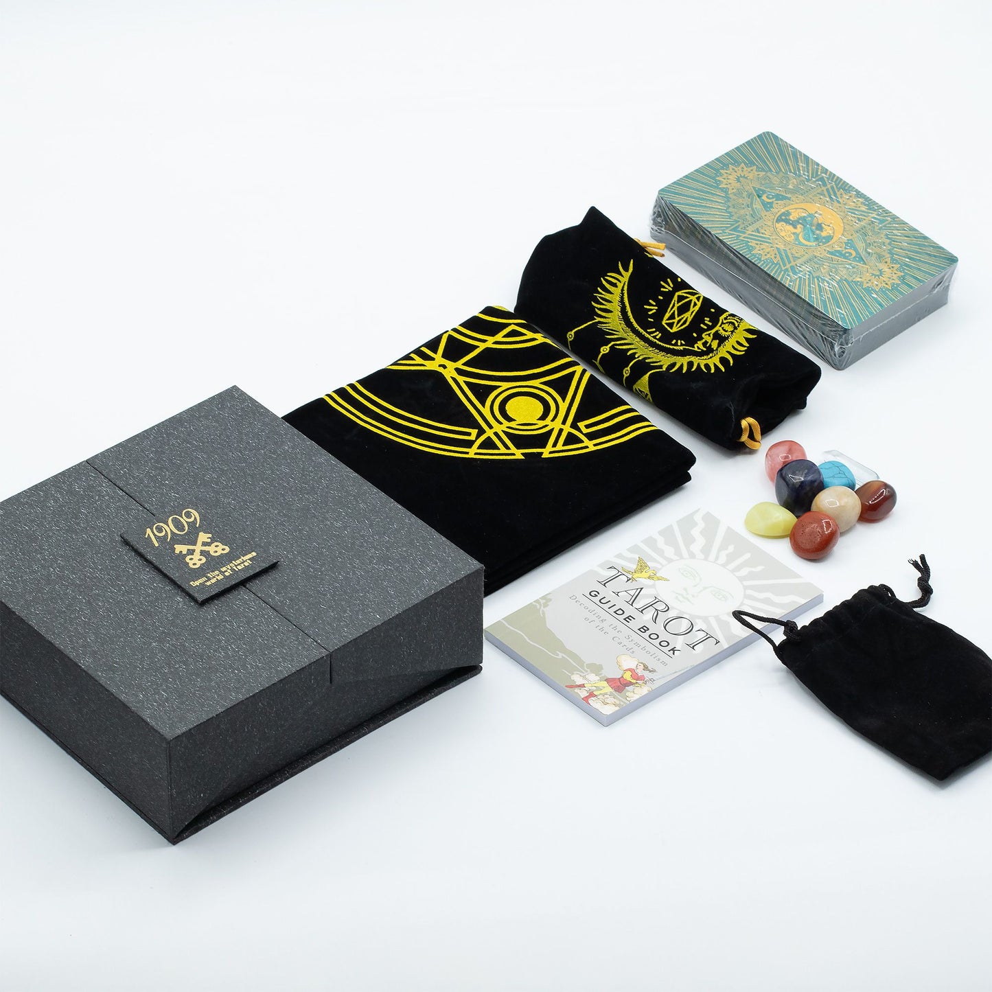 Tarot-Geschenkset mit Karten, Buch, Steinen und Aufbewahrungsbox.