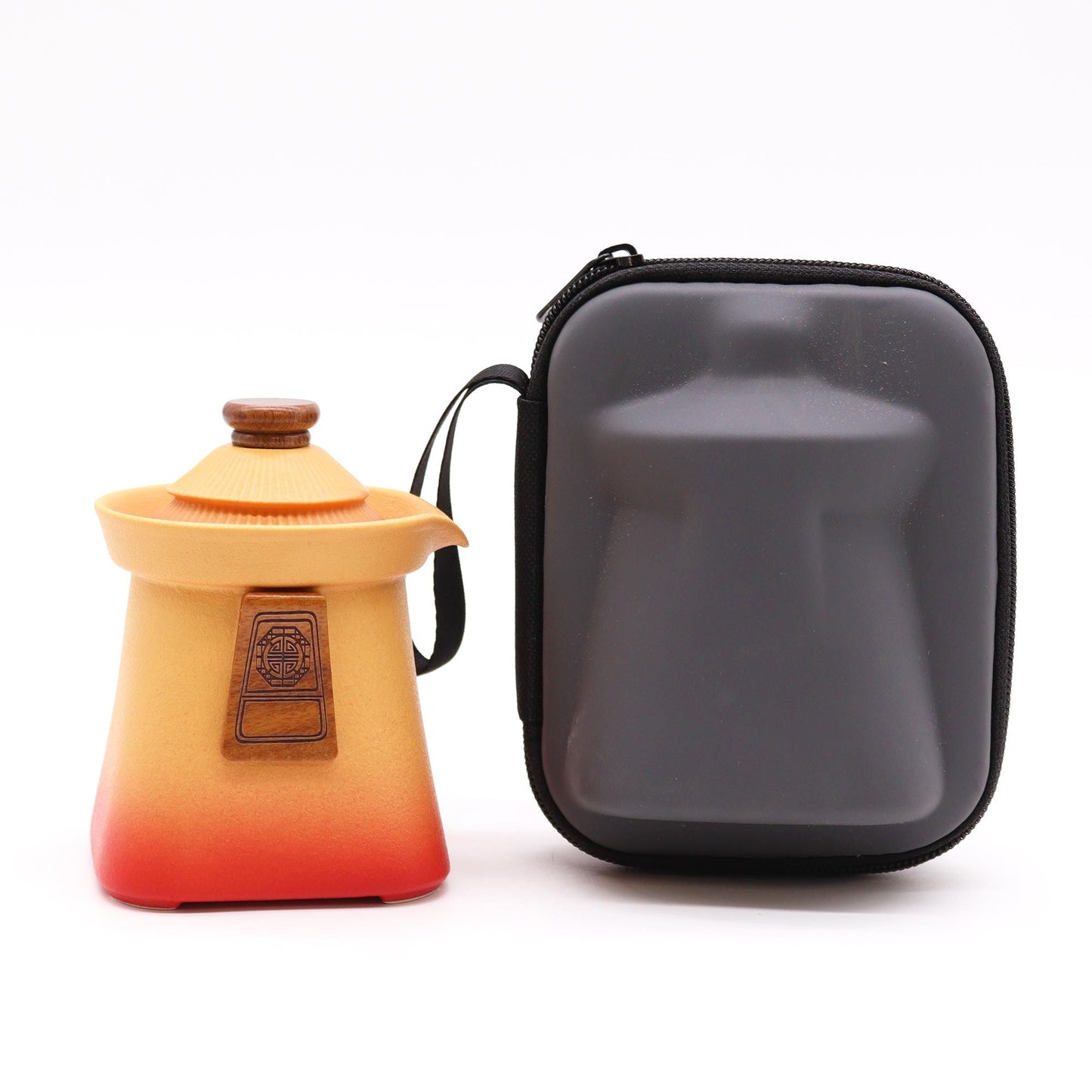 Orange earth-toned teapot with a wooden lid and a black carrying case.