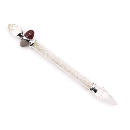 A crystal wand with a faceted crystal point, a Shiva Lingam stone, and a tube filled with rock quartz chips.