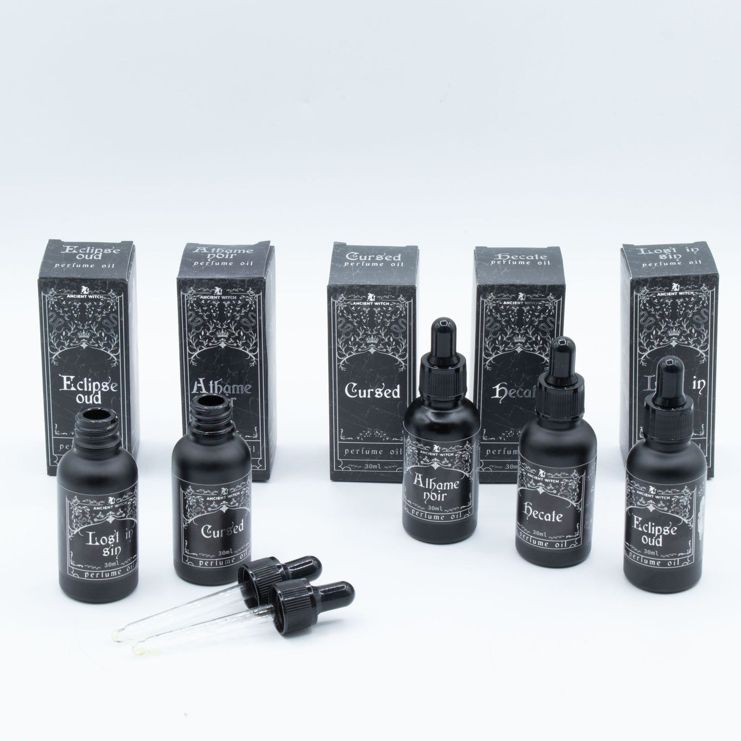 Six bottles of Ancient Witch perfume oil with matching boxes, including Hecate.
