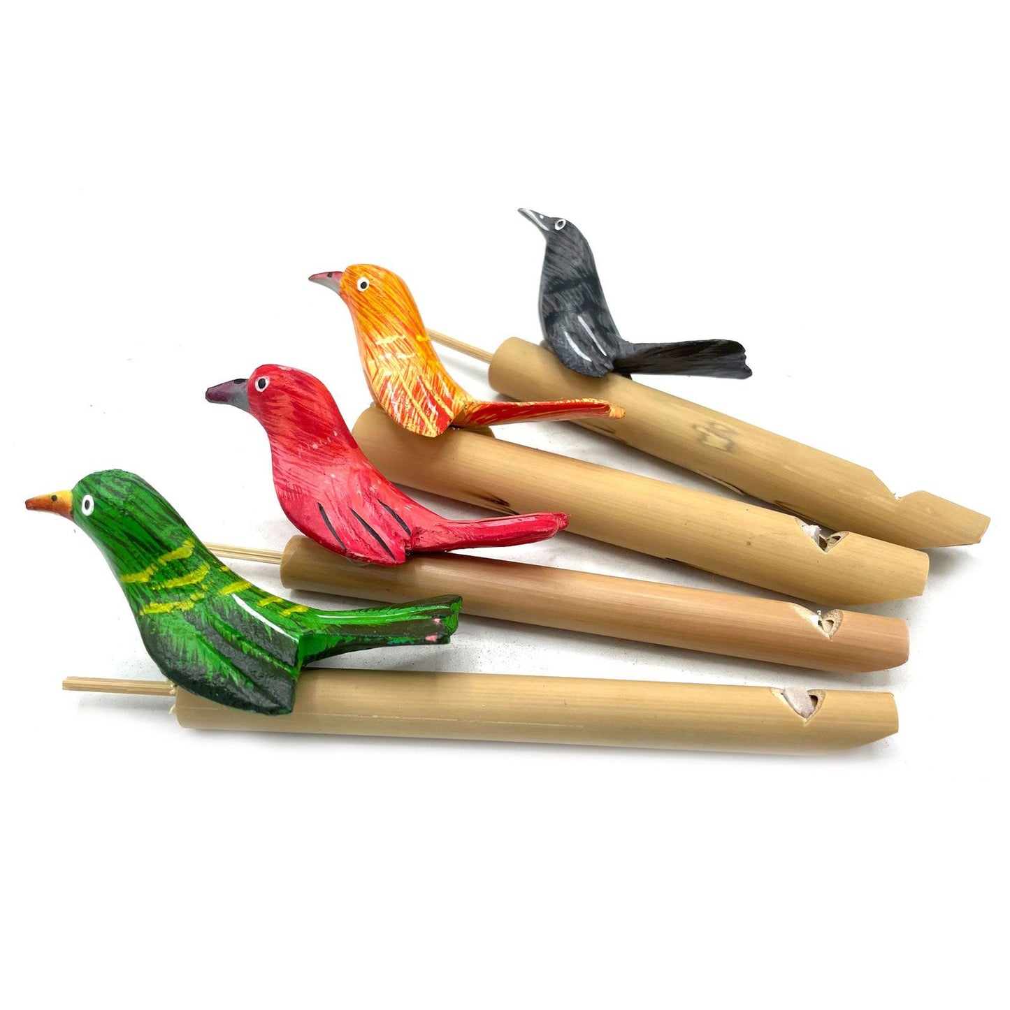 Four colorful wooden bird whistles on bamboo tubes.