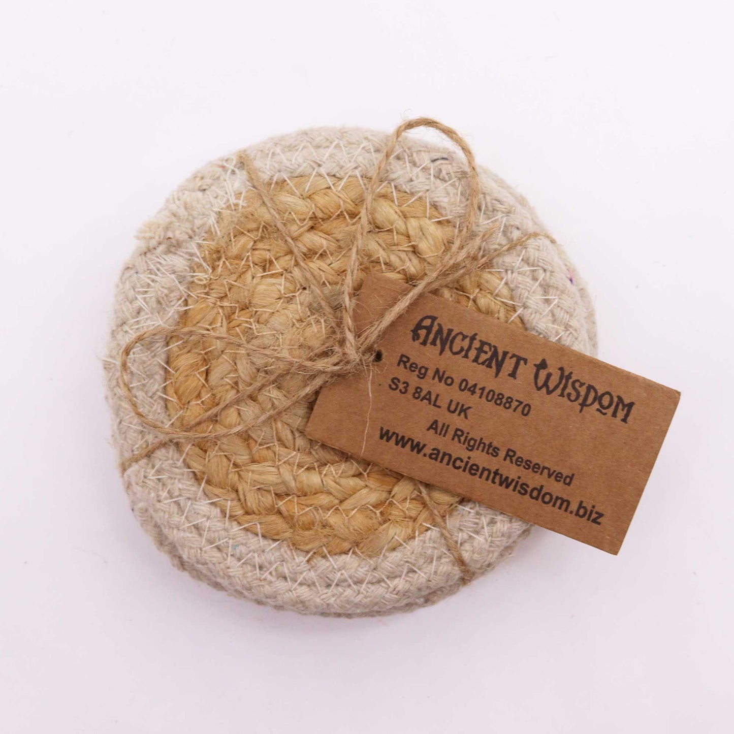 Set of four round jute and cotton coasters with an ivory border.